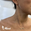 Nalu Necklace, Earrings, and Surfboard necklace puton image